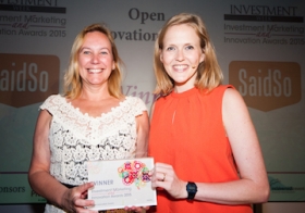 Esther Dadswell (left) collects Open Innovation Award from host Pippa Evans
