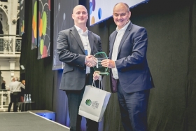 Paul Hennessy, group operations manager at Financial Planner LEBC, awarded e-Adviser of the Year by Hamish Purdey, chief executive of Intelliflo