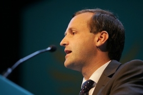 Sir Steve Webb speaking at an industry conference